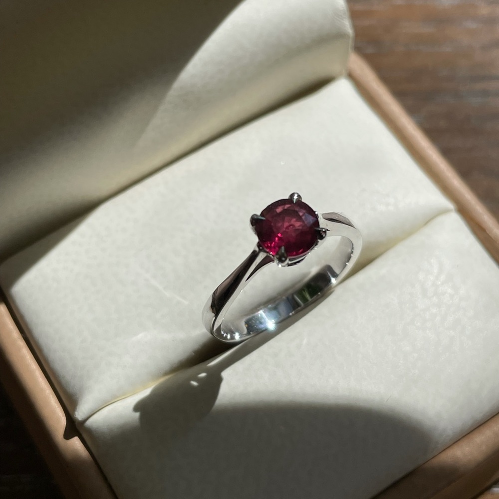 Round ruby in platinum-plated silver ring, size 5